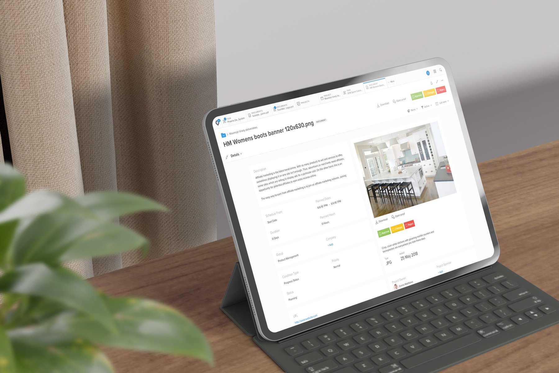An iPad on a wooden desk showing a Workfront Proof document detail for "HM Womens boots banner", with an approve / changes / reject toolbar next to a kitchen-interior proof image